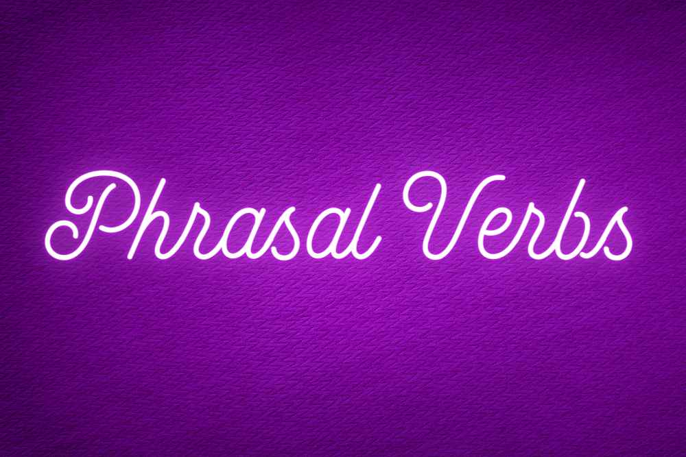 imagem escrito "phrasal verbs" em um fundo roxo